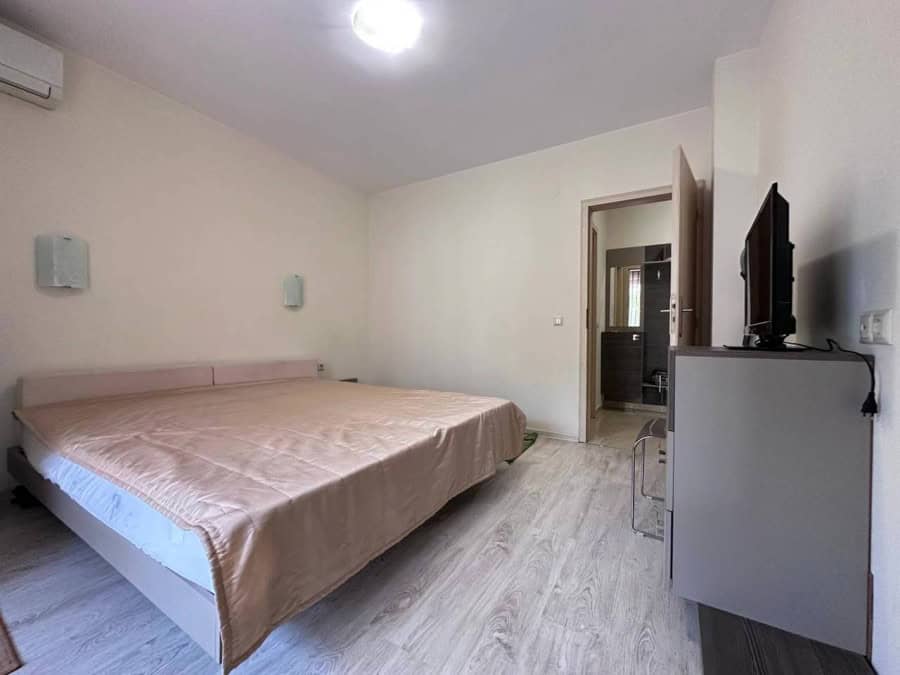 Interior of a 1-bedroom apartment in Sveti Vlas, near the sea, with a large bed and modern furnishin.