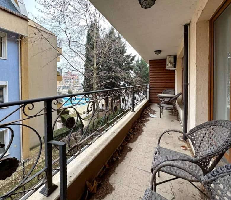 Sea view sunny 1-bedroom apartment in Ravda, Bulgaria, with spacious balcony and outdoor seating.