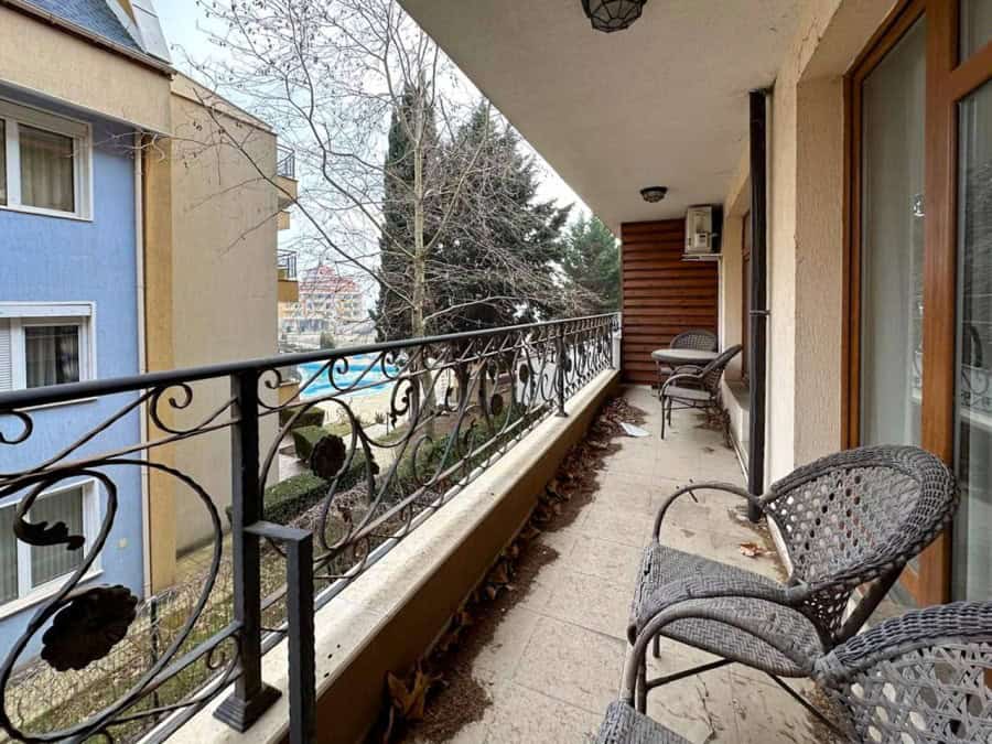 Sea view sunny 1-bedroom apartment in Ravda, Bulgaria, with spacious balcony and outdoor seating.