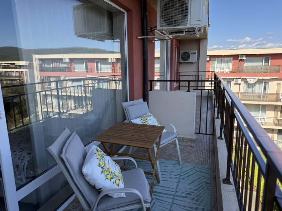Cozy top floor studio balcony in Sunny Beach Balcony of a top floor studio in Holiday Fort Club, Sunny Beach, with outdoor seating and city views.