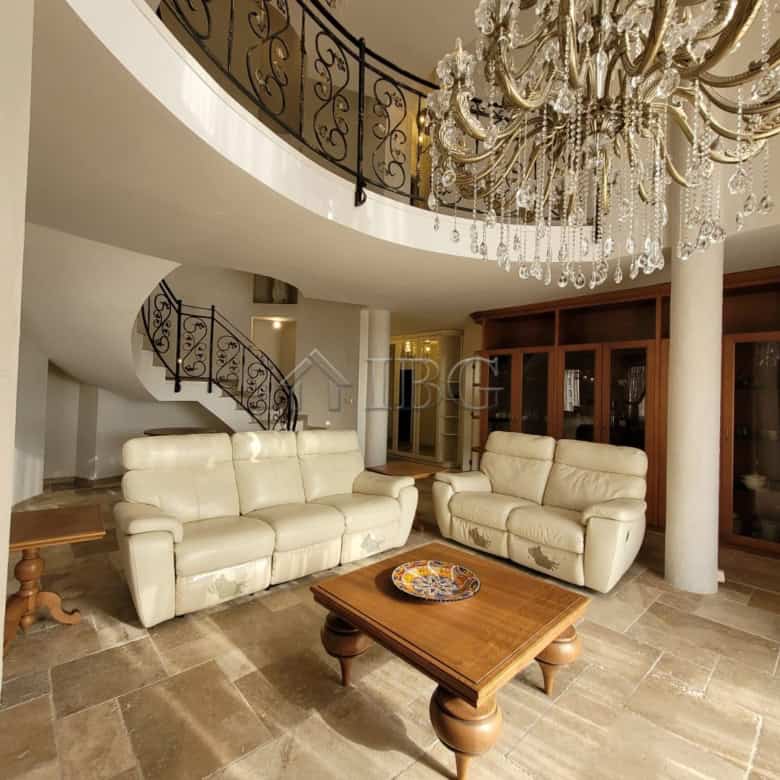 Elegant living room with cream sofas and grand chandelier in Sveti Vlas.