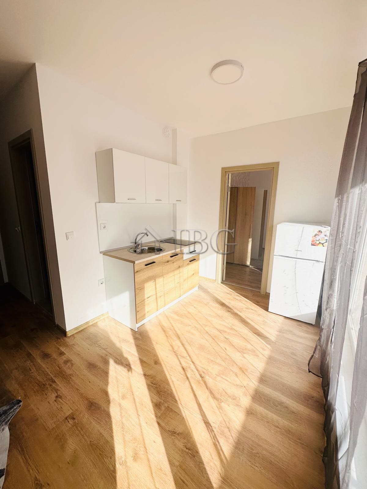 Bright kitchen area in a sunny apartment in Sunny Beach, perfect for relaxing holidays.