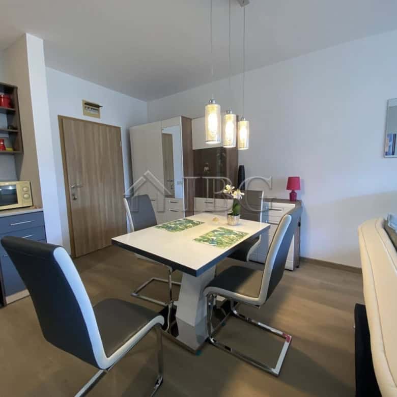 Bright interior of a one-bedroom apartment with a private yard in Vineyards Resort, Aheloy, Bulgaria.