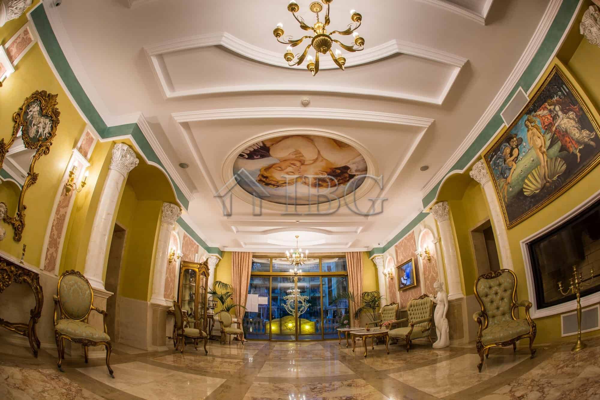 Elegant hotel lobby with luxurious decor and classic furniture in a grand setting.