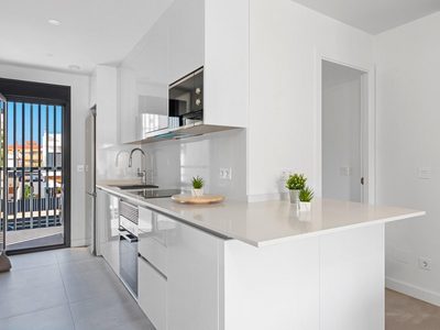 Bright, contemporary kitchen in a stylish 2-bedroom apartment in Santiago De La Ribera, Murcia, Spai.