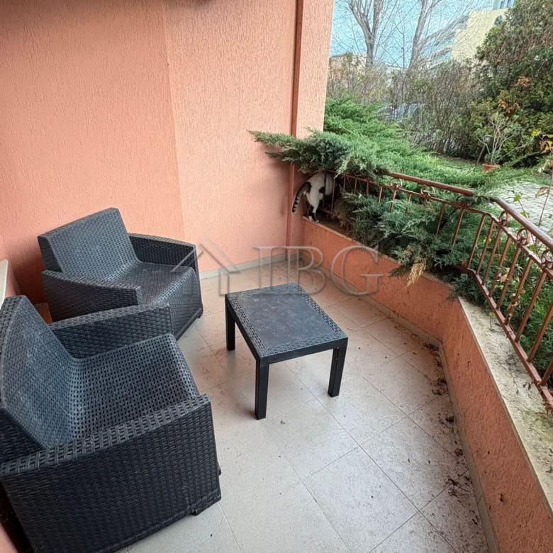 Cozy balcony with outdoor seating overlooking the pool in Sunflower complex, Sunny Beach.