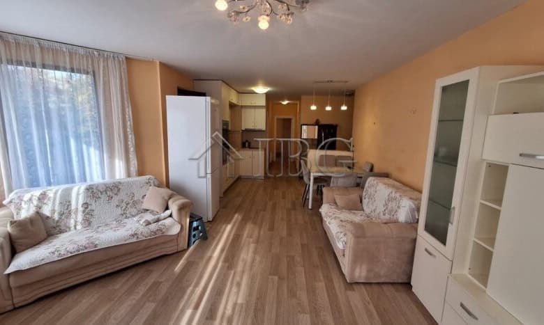 Interior view of a 2-bedroom apartment in Ravda with living room and kitchen area.