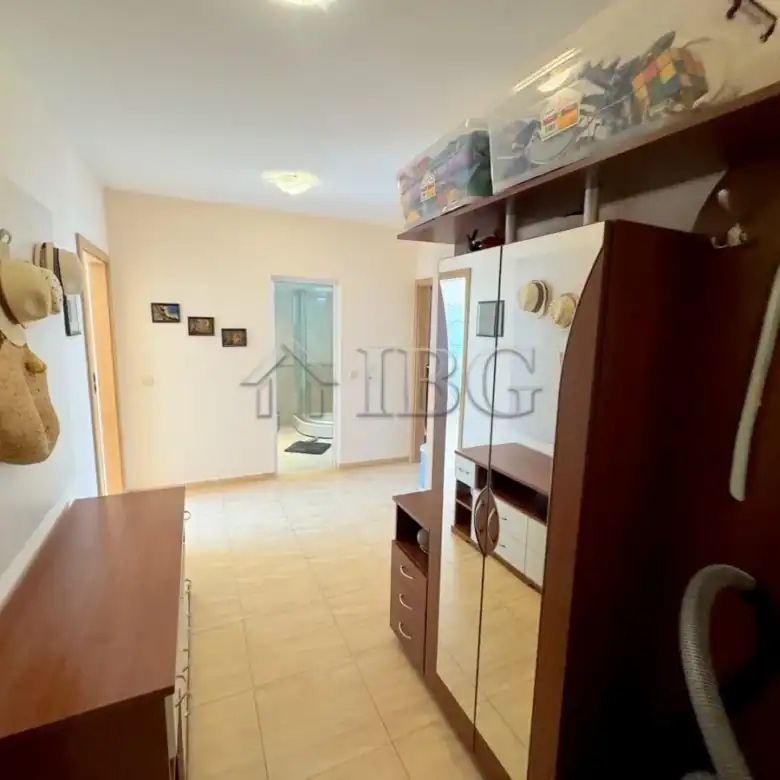 Interior view of a 2-bedroom apartment in Sveti Vlas, Bulgaria, with furniture and hallway.