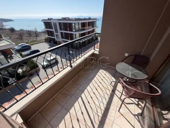 Sea view balcony with outdoor seating in a luxury apartment in Sarafovo.