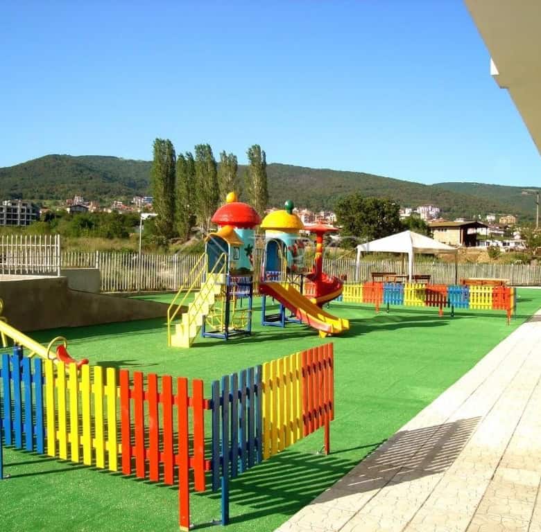 Bright children's playground with slides and climbing structures in Butterfly Complex, Sveti Vlas.