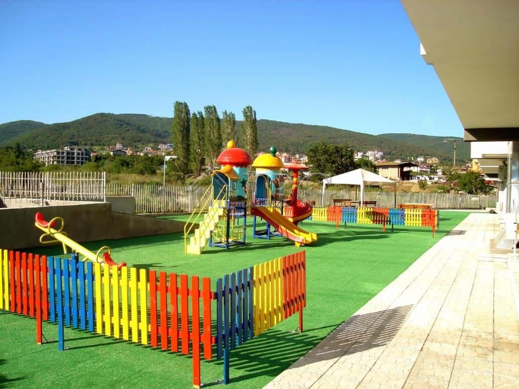 Bright children's playground with slides and climbing structures in Butterfly Complex, Sveti Vlas.
