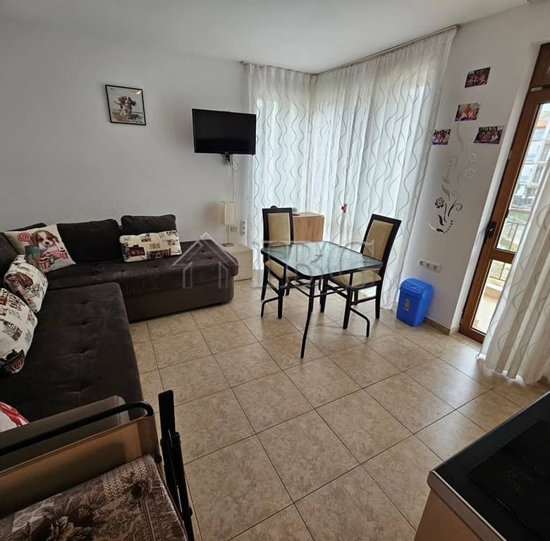 Bright living room with pool view in Sveti Vlas apartment for sale.