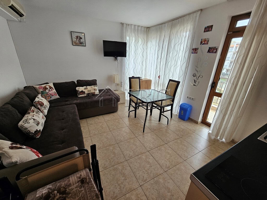 Bright living room with pool view in Sveti Vlas apartment for sale.