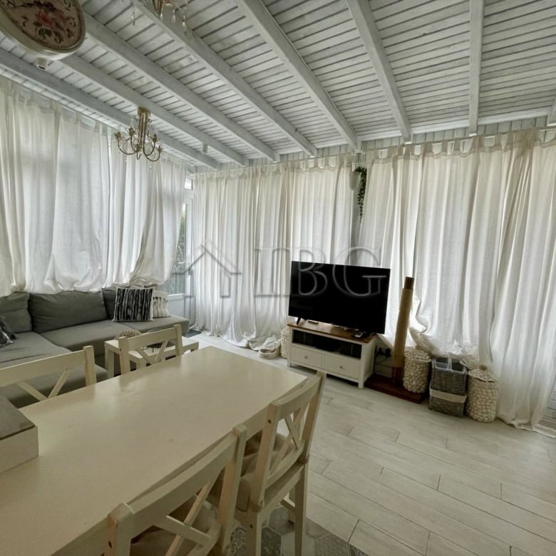 Bright living room with white curtains and modern furniture in Sun Gate, Sunny Beach.