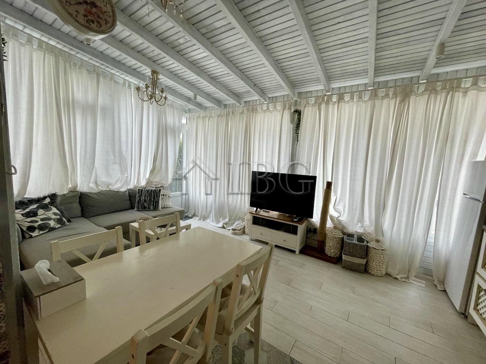 Bright living room with white curtains and modern furniture in Sun Gate, Sunny Beach.