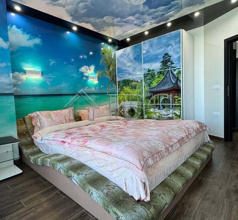 Sea view bedroom with modern decor and ocean mural in Atlantis Resort & Spa, Sarafovo, Burgas.