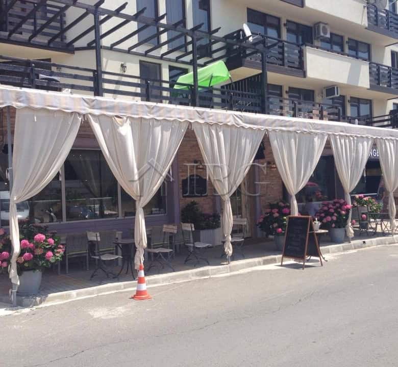 Exclusive restaurant setup in Nessebar with elegant drapes and outdoor seating.