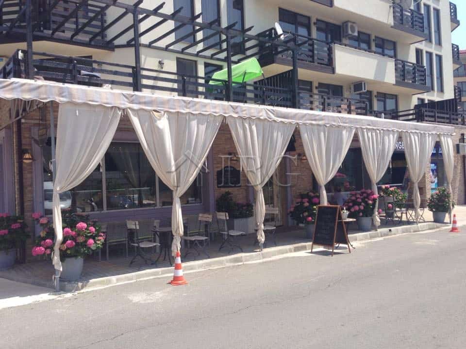 Exclusive restaurant setup in Nessebar with elegant drapes and outdoor seating.