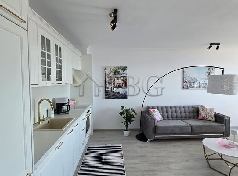 Spacious living area with contemporary decor in a luxury Sveti Vlas apartment, featuring a comfortab.