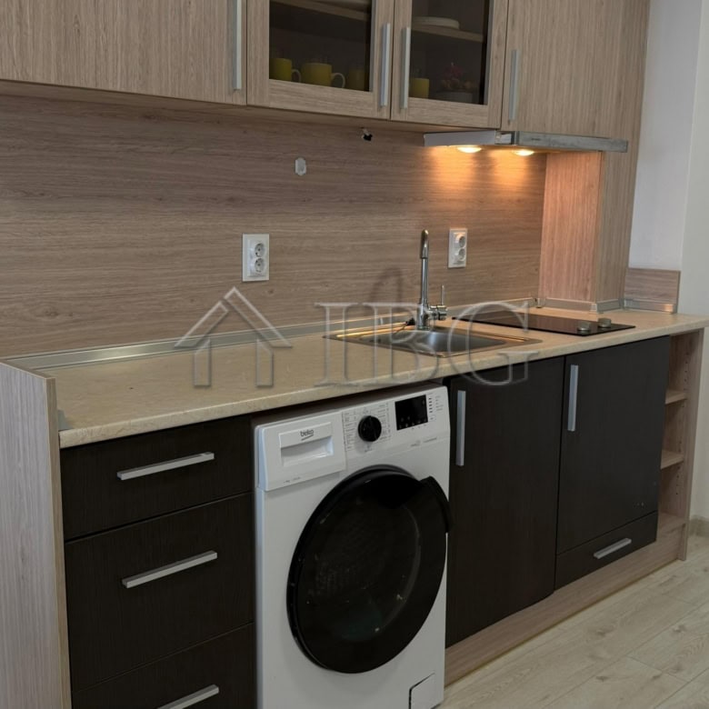 Bright 1-bedroom apartment with modern kitchen in Pomorie Beach Resort, perfect for seaside living.