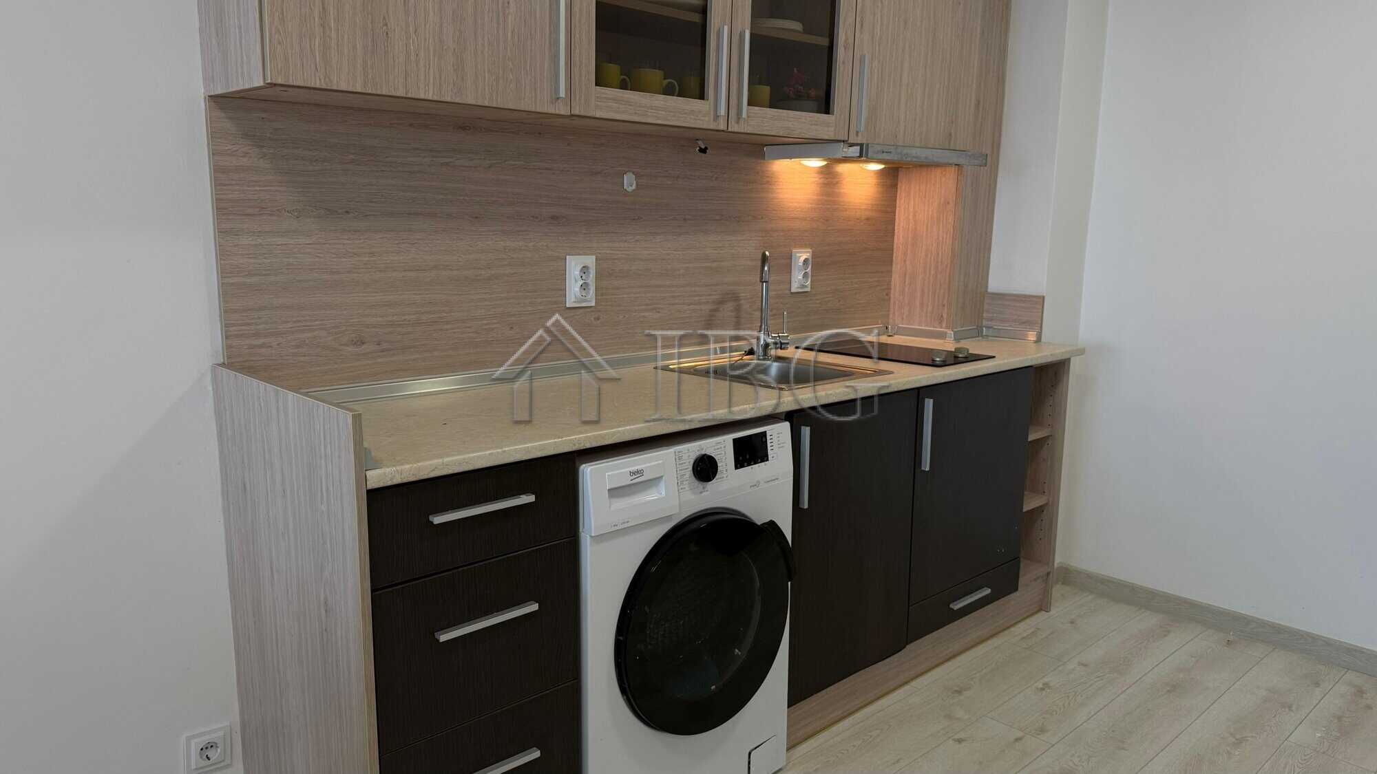 Bright 1-bedroom apartment with modern kitchen in Pomorie Beach Resort, perfect for seaside living.
