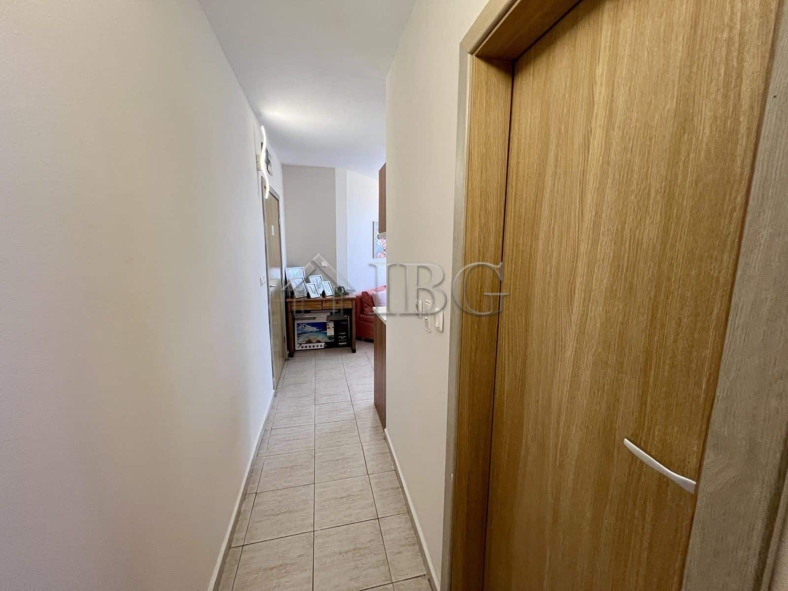 Apartment hallway leading to living area with pool view in Sveti Vlas.