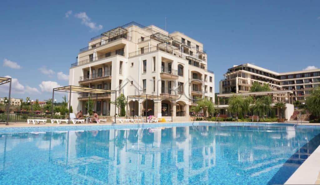 Apartment with pool view in Sveti Vlas, Bulgaria, featuring modern furnishings and spacious balcony.