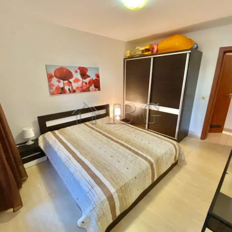 Bright bedroom with large bed and modern decor in Sveti Vlas.