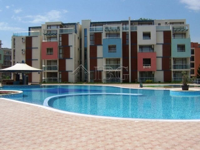 Furnished studio with separate kitchen, balcony, and pool view at Sun City 1, Sunny Beach.