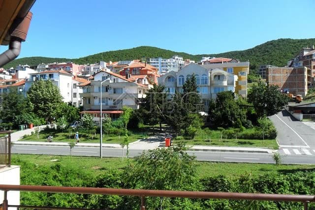 View of Sveti Vlas residential buildings with greenery and mountains in the background.