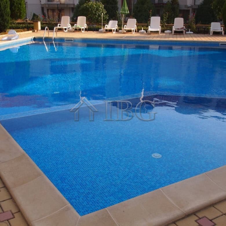 Pool view of a 1-bedroom apartment in Sveti Vlas with Dinevi Resort amenities and scenic surrounding.