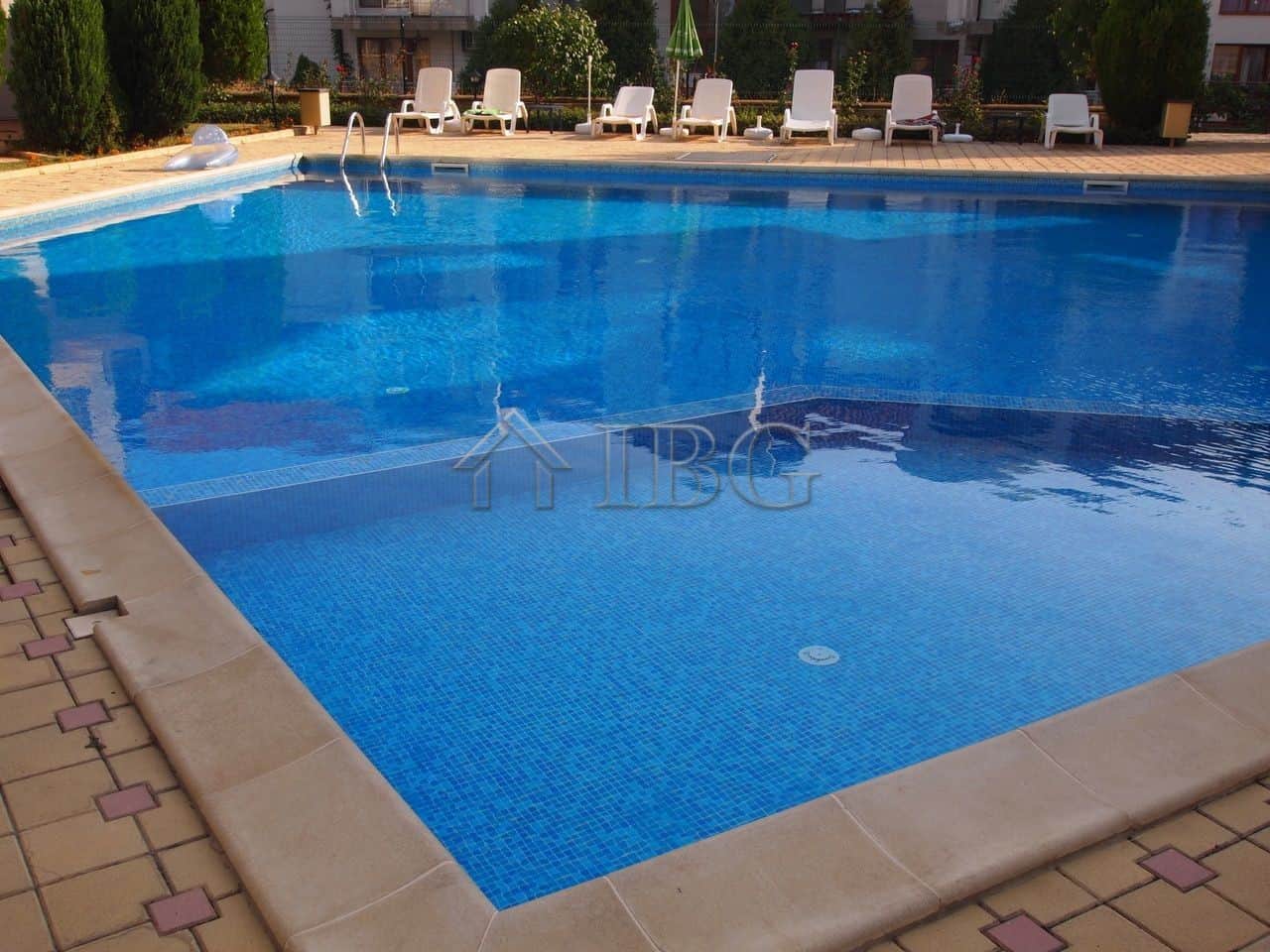 Pool view of a 1-bedroom apartment in Sveti Vlas with Dinevi Resort amenities and scenic surrounding.