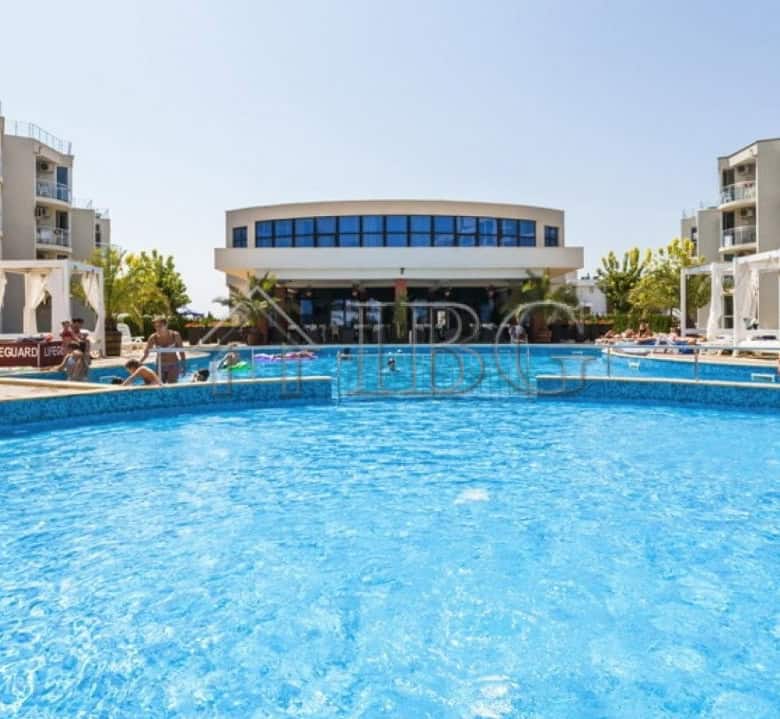 Pool view at Atlantis Resort & Spa in Sarafovo, Burgas, featuring modern apartments with sea and poo.