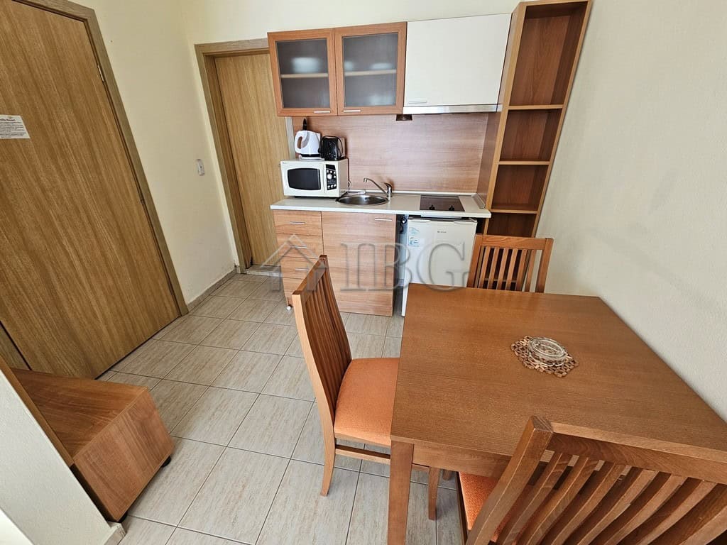 Compact studio with balcony overlooking pool at Pollo Resort, Sunny Beach.