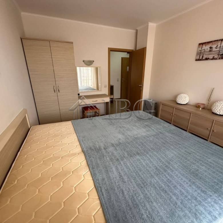 Cozy bedroom with a large bed and modern decor in Royal Sun, Sunny Beach.