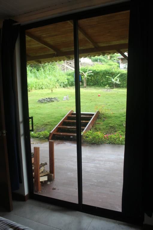 Beautiful view of a lush garden from the house in Portal de Mindo, Ecuador. Spacious property ideal.