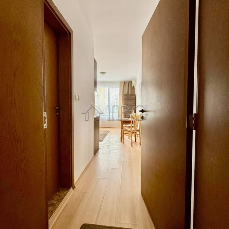Interior view of furnished studio apartment with pool view in Sunny Day 3, Sunny Beach.