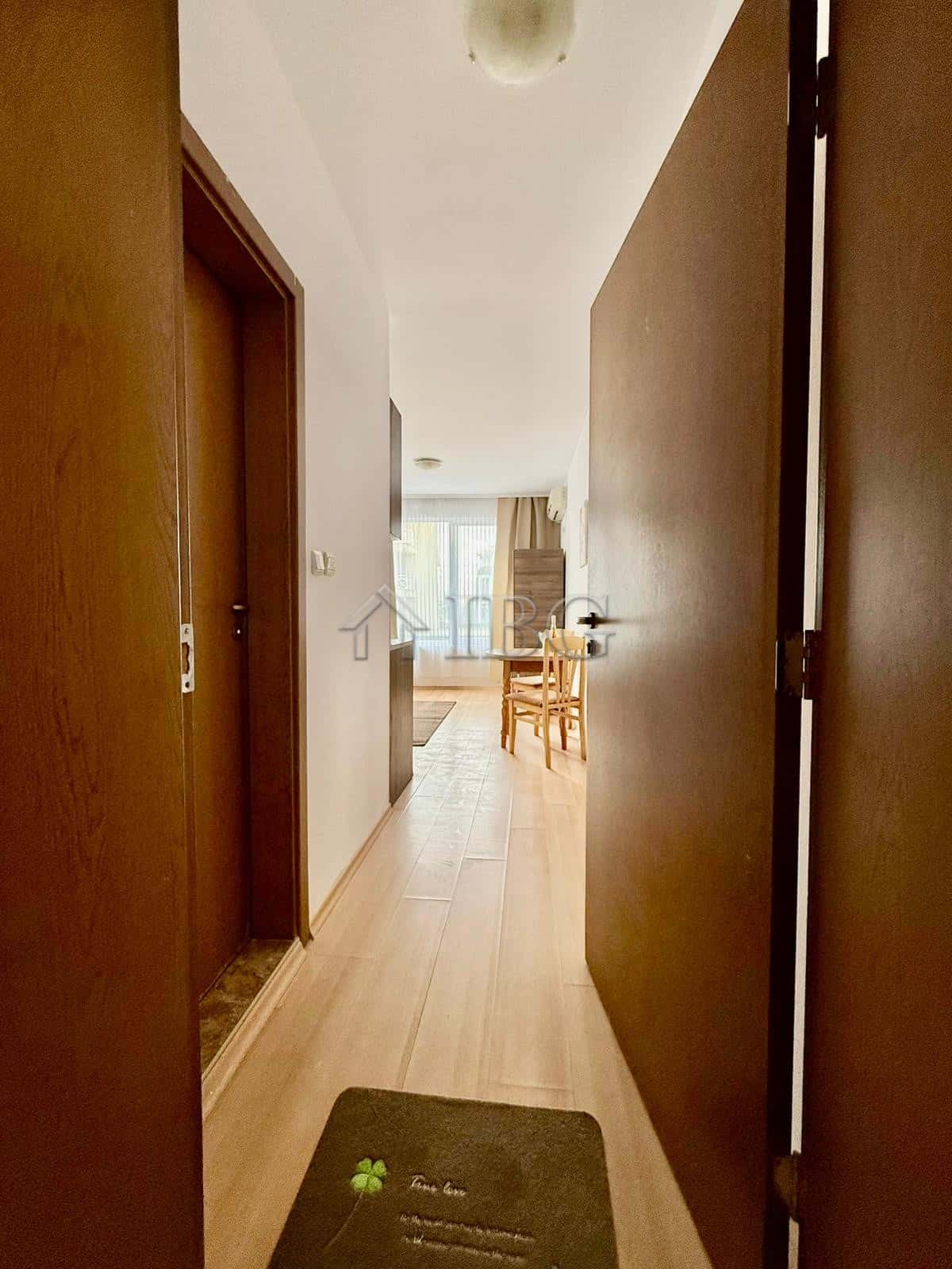 Interior view of furnished studio apartment with pool view in Sunny Day 3, Sunny Beach.