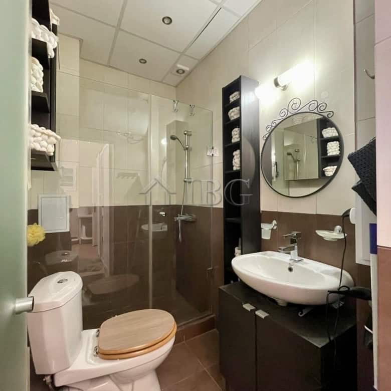 Bright, clean bathroom with shower, toilet, and vanity in Sun Gate, Sunny Beach.