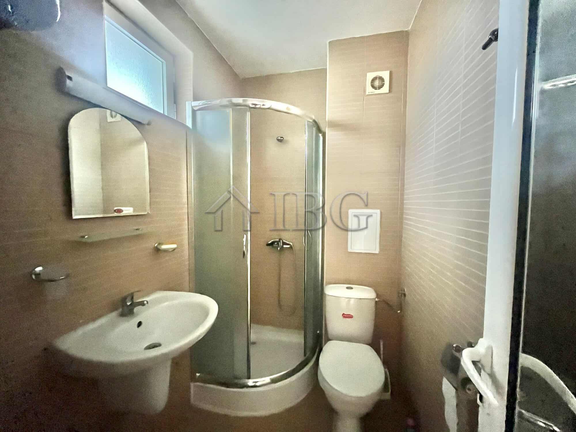 Modern bathroom with shower cabin, sink, and toilet in Sveti Nikola complex, Sveti Vlas.
