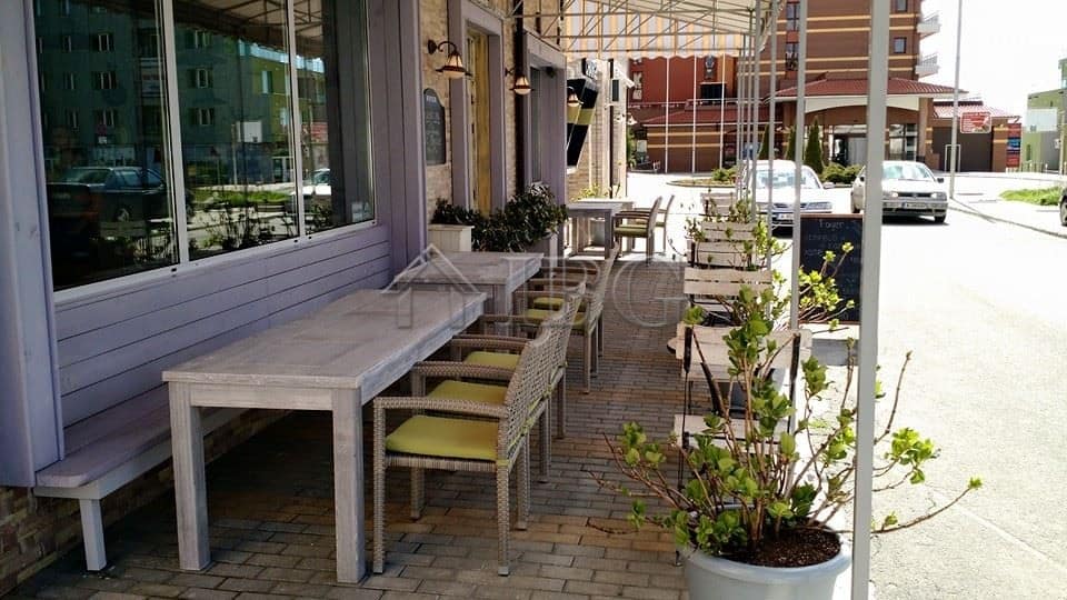 Outdoor dining area of a restaurant in Nessebar with tables and chairs.