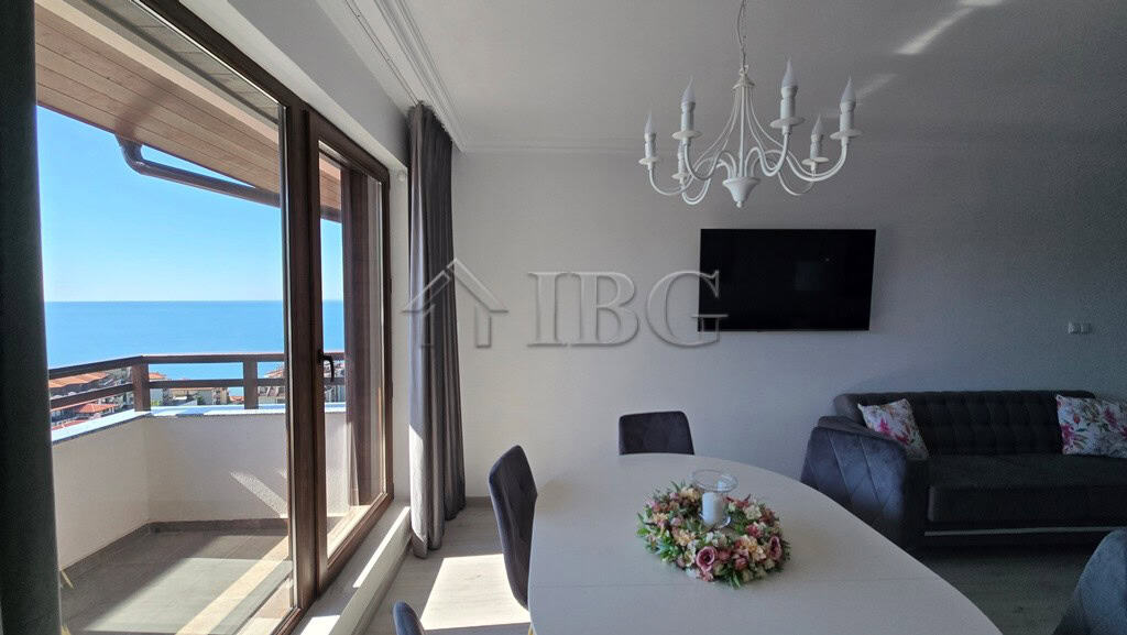 Bright living room with balcony view of the sea in Sveti Vlas apartment.