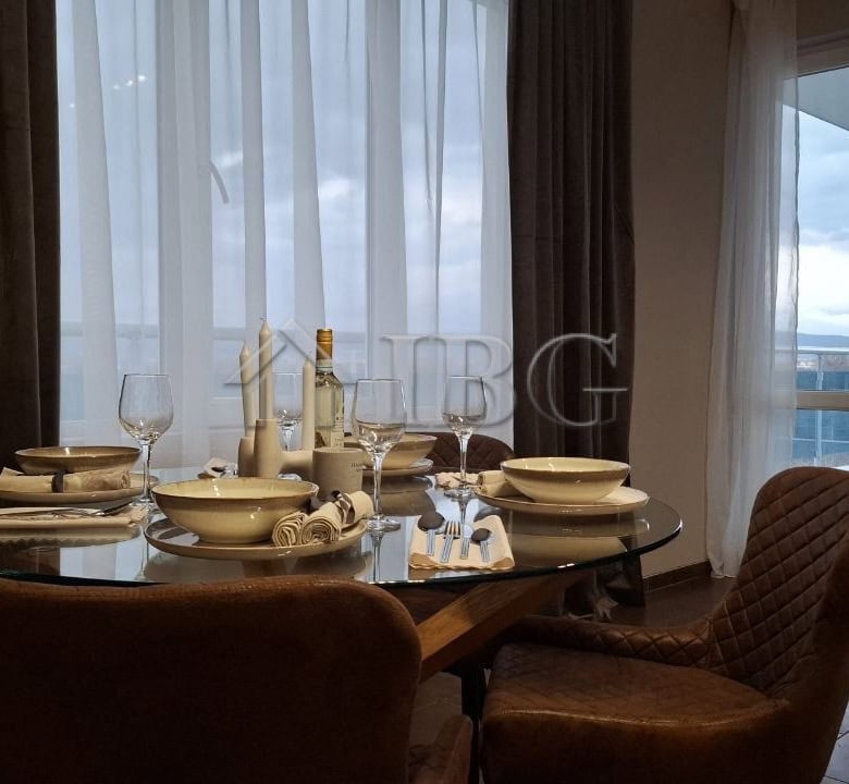 Stylish 2-bedroom apartment interior with elegant dining setup in Nessebar, Bulgaria.