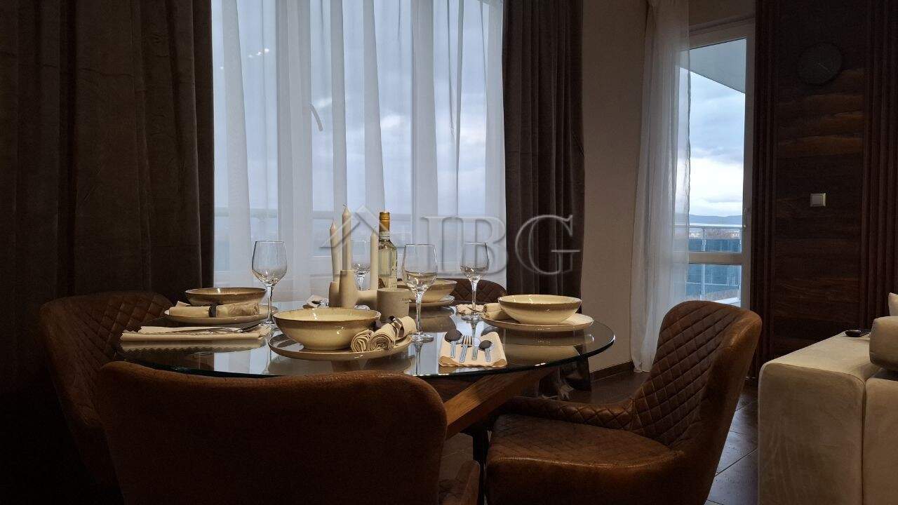 Stylish 2-bedroom apartment interior with elegant dining setup in Nessebar, Bulgaria.