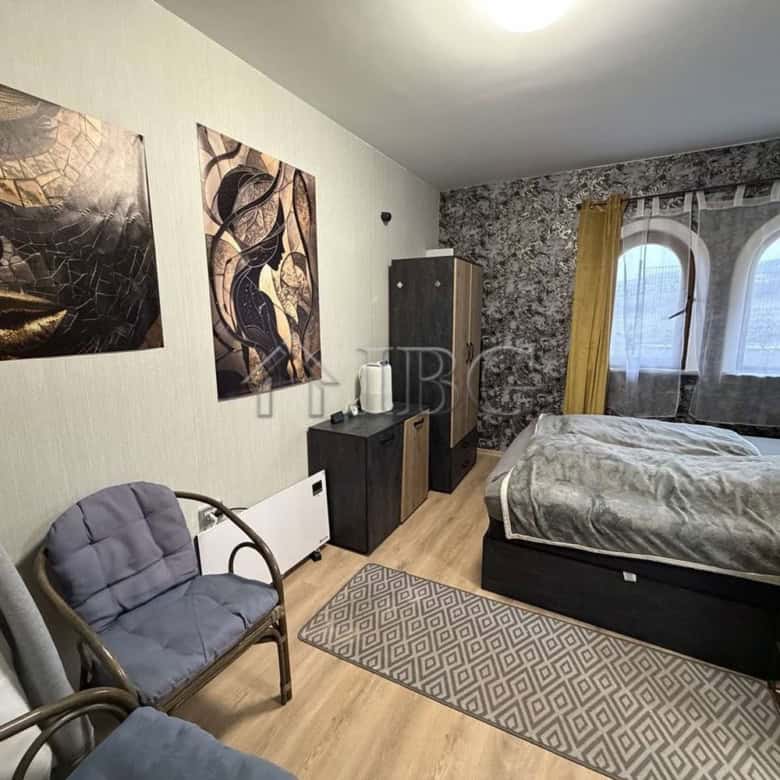 Spacious one-bedroom apartment featuring a large terrace, modern furnishings, and scenic views in th.