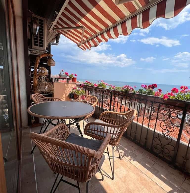 Bright balcony with panoramic sea views and outdoor seating in Sveti Vlas.