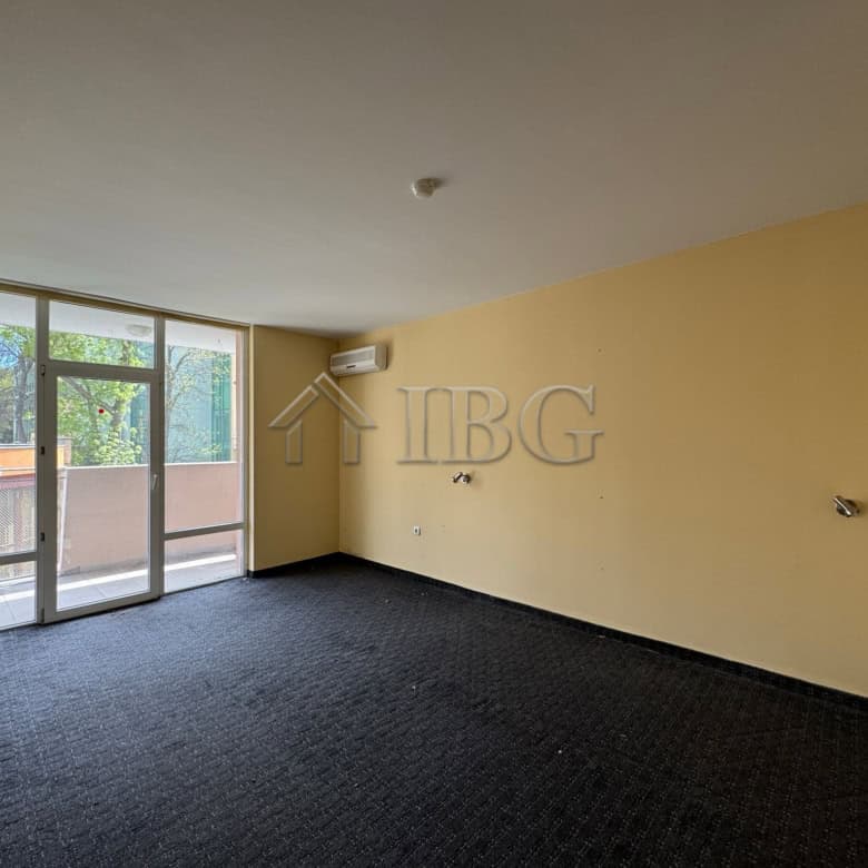 Spacious hotel room with large windows and balcony, ideal for investment or hospitality business in.
