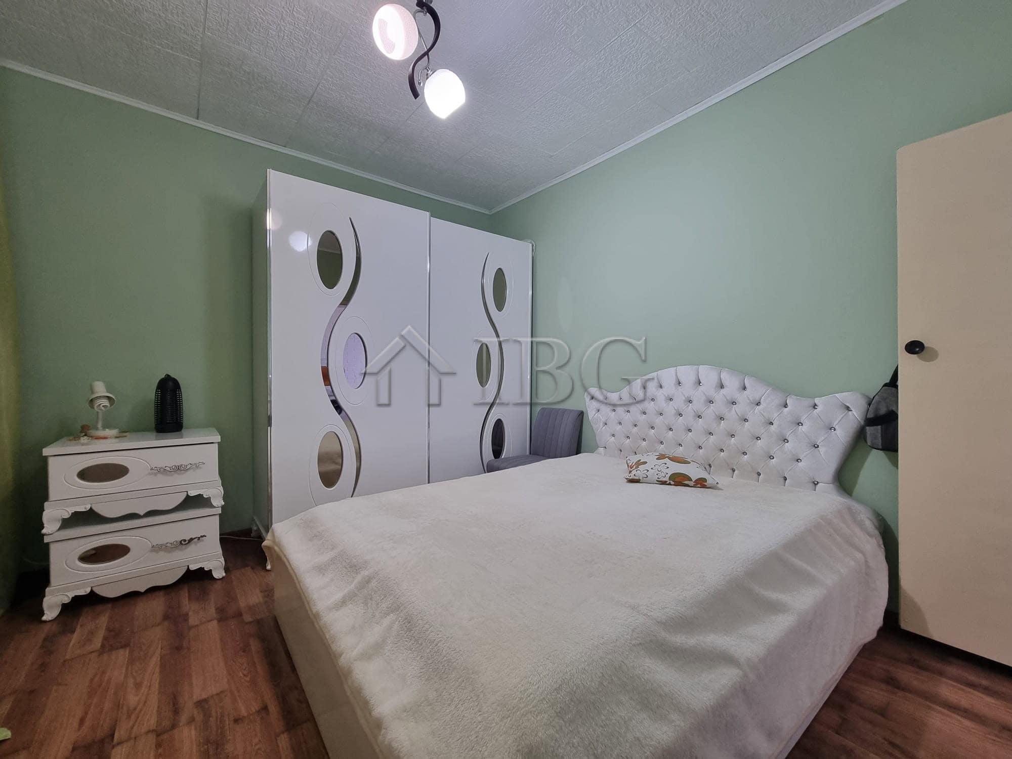 Cozy bedroom with wardrobe and bed in Vinarsko Village, Burgas Region. Ideal for peaceful living and.