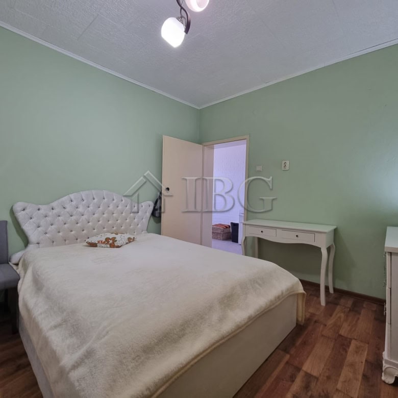 Comfortable bedroom with green walls and classic furniture in Vinarsko Village, Burgas Region.