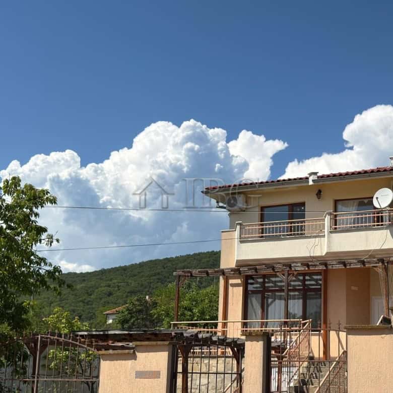 Two-storey house with balcony near the sea in Kosharitsa, Bulgaria.